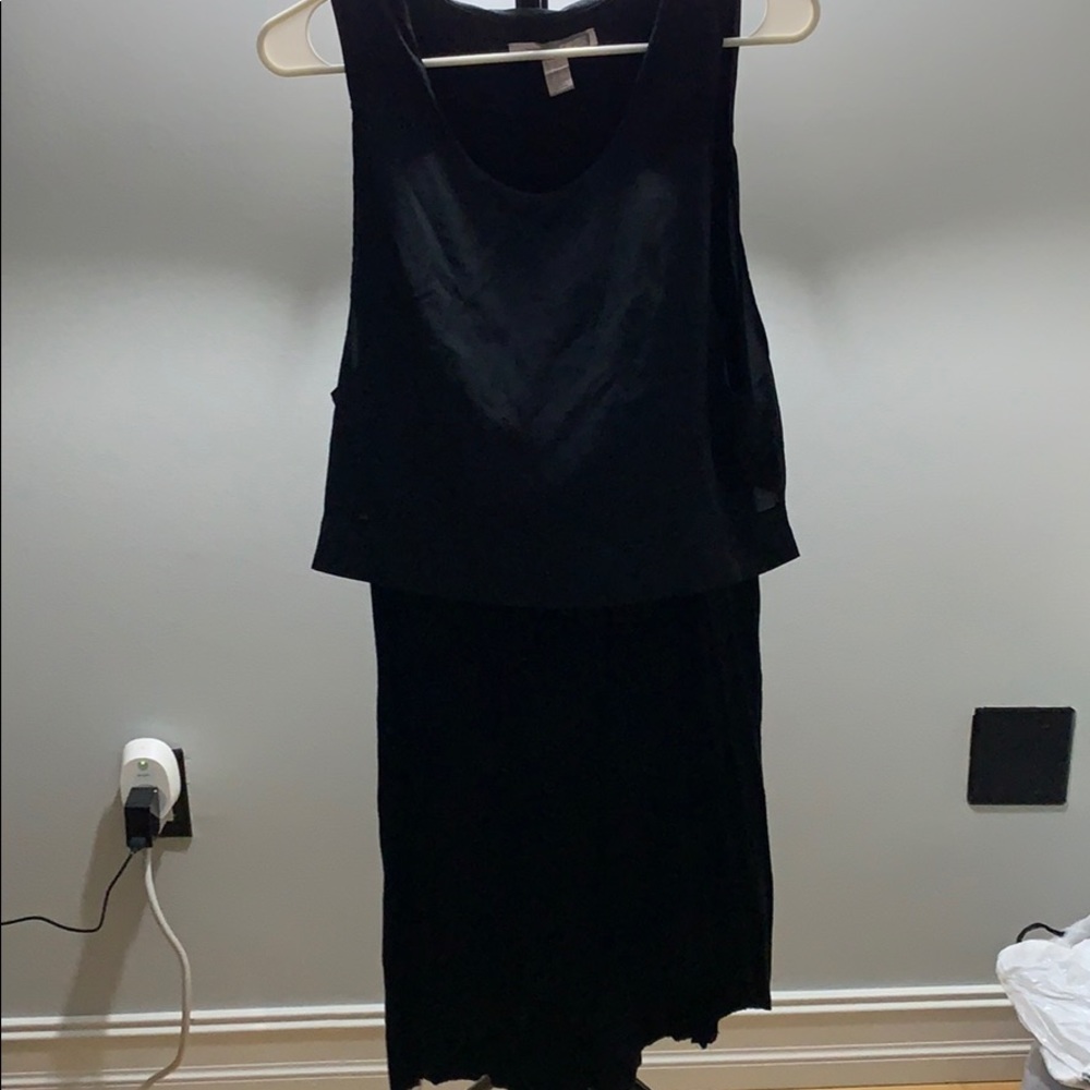 Mid length black dress. Great for work